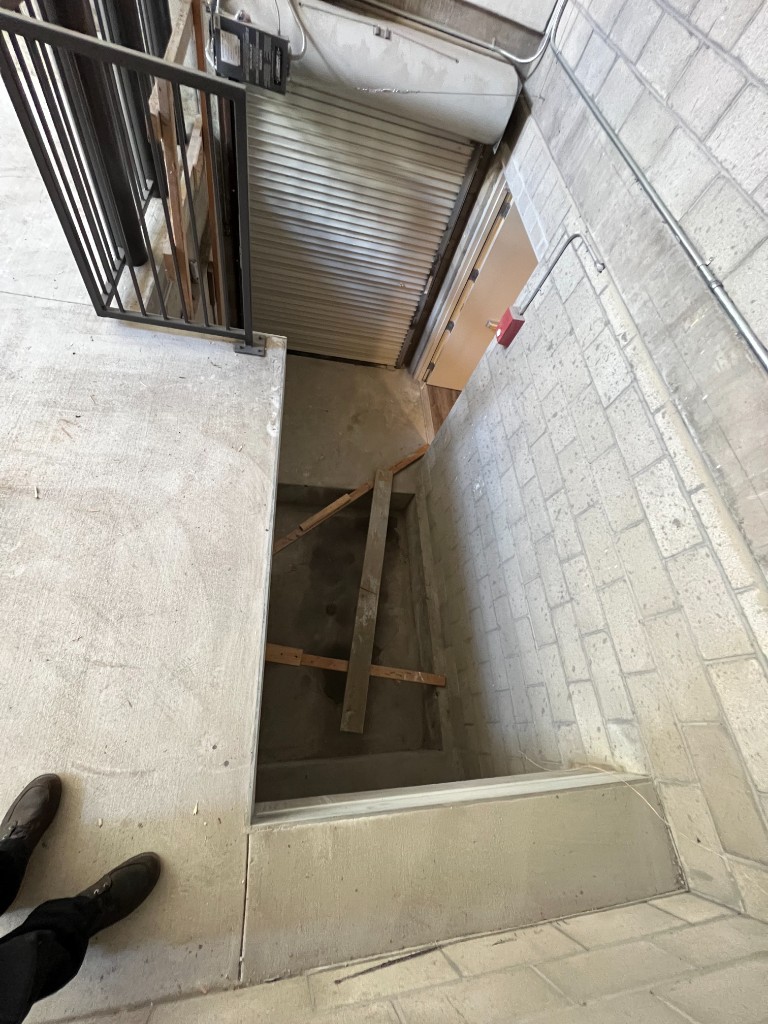 Before service bay reliability upgrade with open shaft and unfinished access pit